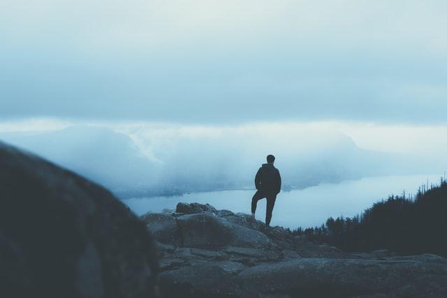 Man contemplating about the future on hilltop